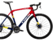 Bicykel Trek Domane SLR 9 AXS Gen 4 Team Replica:Metallic Red Smoke to Blue Smoke Fade 2024